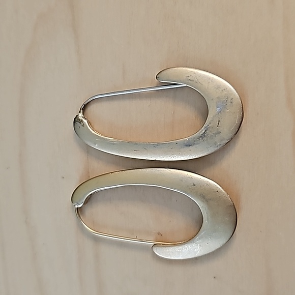 Gold tone stylized elongated hoop earrings - Picture 2 of 3